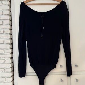 Wolford bodysuit. Adjustable neckline with metal tipped strings. One size.